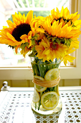 sunflowers and lemons in vase